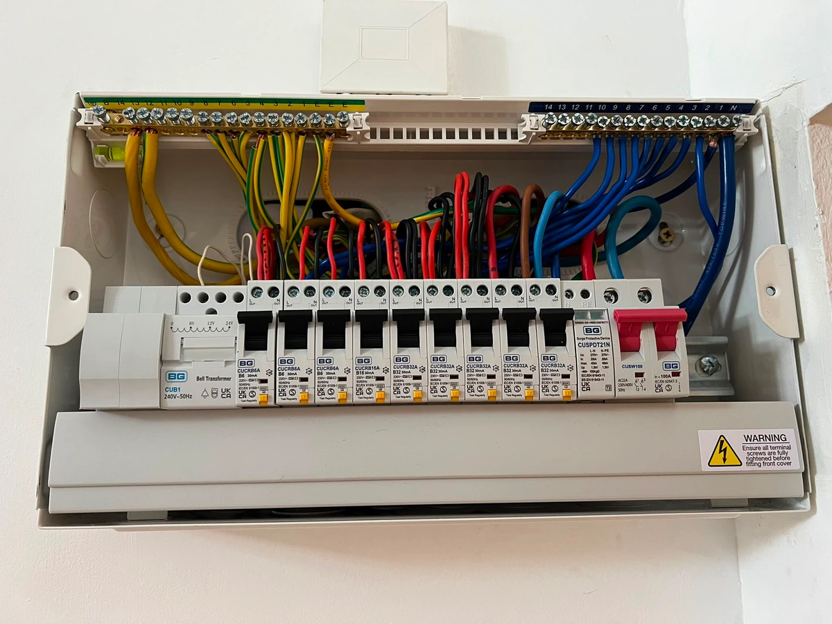 Consumer unit with bell transformer on a plastered wall